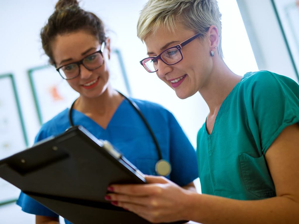 Two nurses reviewing patient information